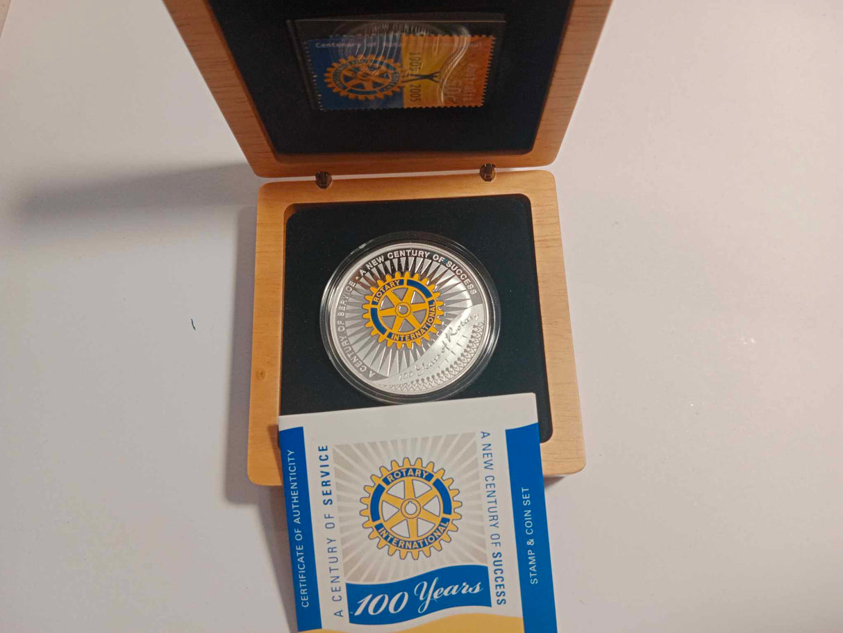 2005 $1 Coin and Stamp Set. A Centenary of Service. 100 Years of Rotary.