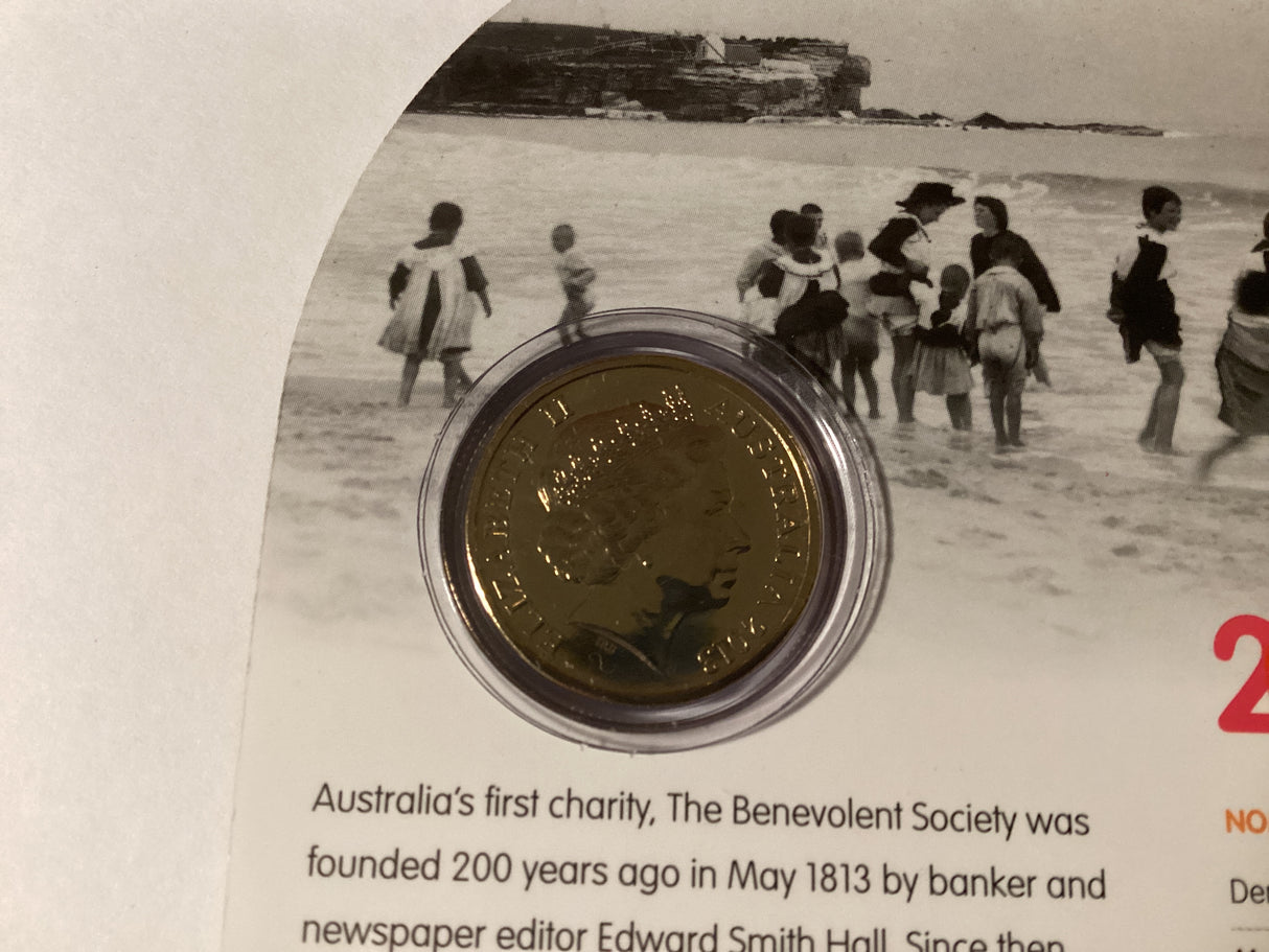 2013 $1 Uncirculated Carded Coin. 200 Years of Benevolent Society.