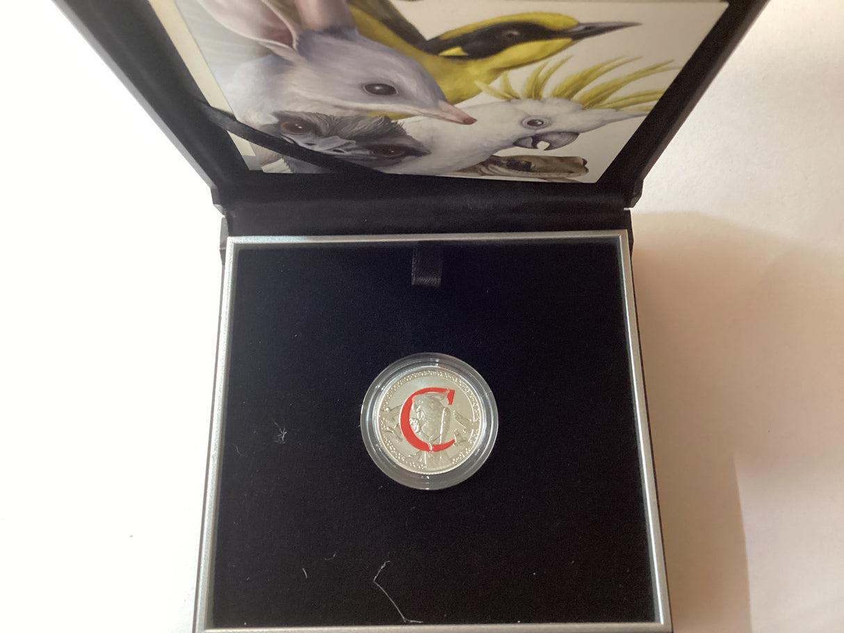 2017 $1 Fine Silver Coloured Proof Coin. Alphabet Series. ‘C’ for Charming.