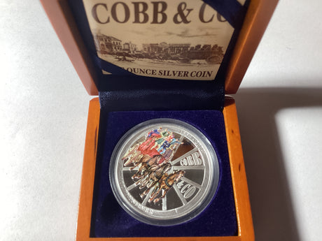 2004 $1 1oz Silver Proof Coloured Coin. Cobb & Co 150 Years.