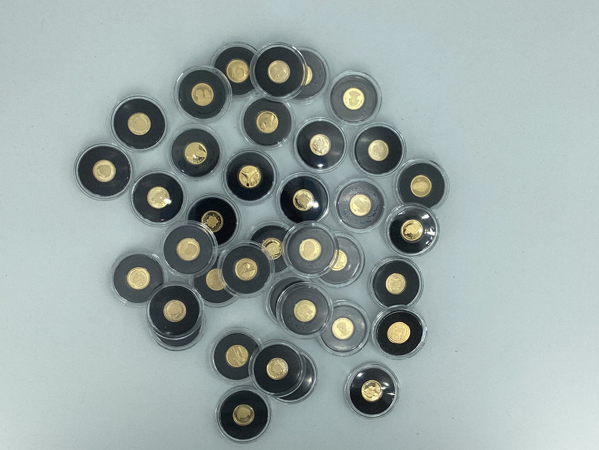 2005- The Smallest Gold Coins of the World. Multiple Countries. 0.5 Grams of Pure Gold in Each Coin.