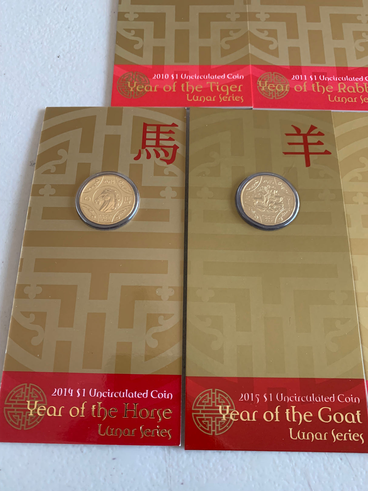 2010-2018 Set Of 9 Lunar $1 Uncirculated Carded Coins.