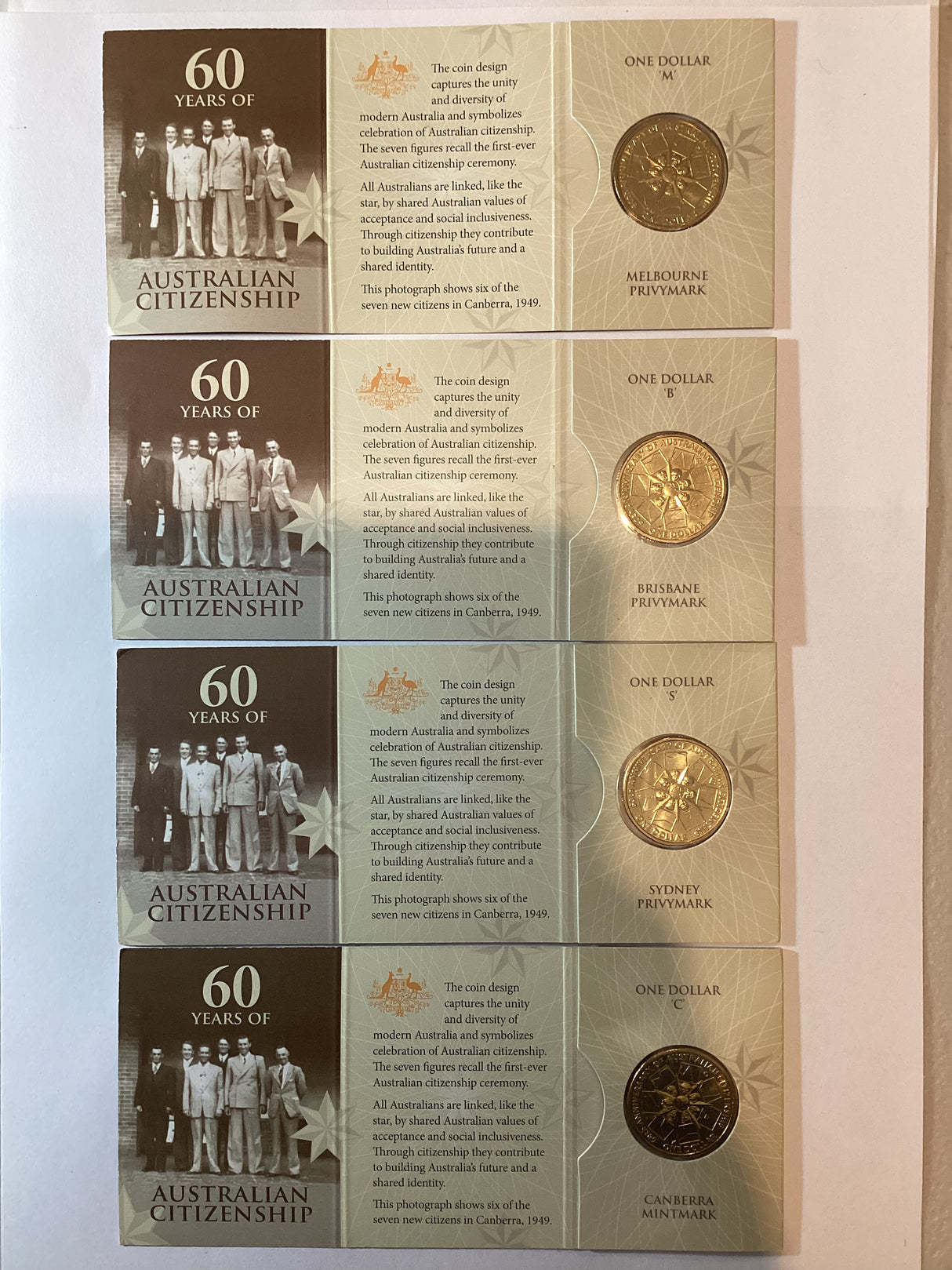 2009 $1 60 Years Australian Citizenship. 'M', 'B', 'S', 'C'.