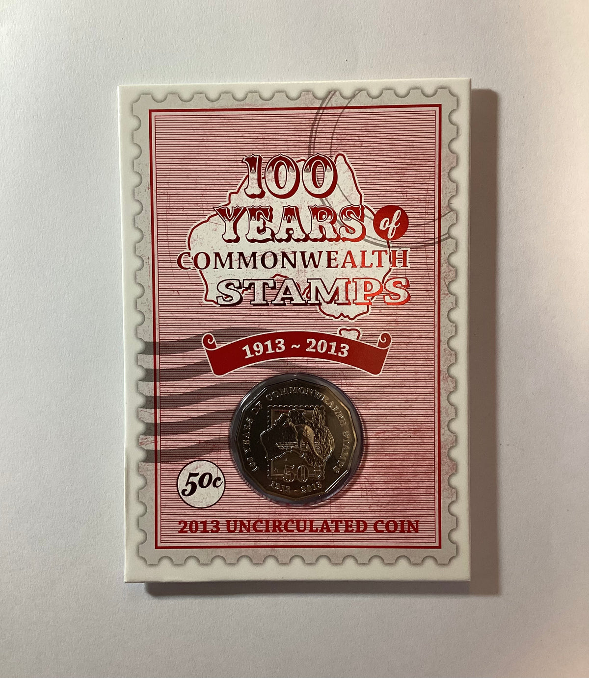 2013 50c 100 Years of Commonwealth Stamps Carded Coin