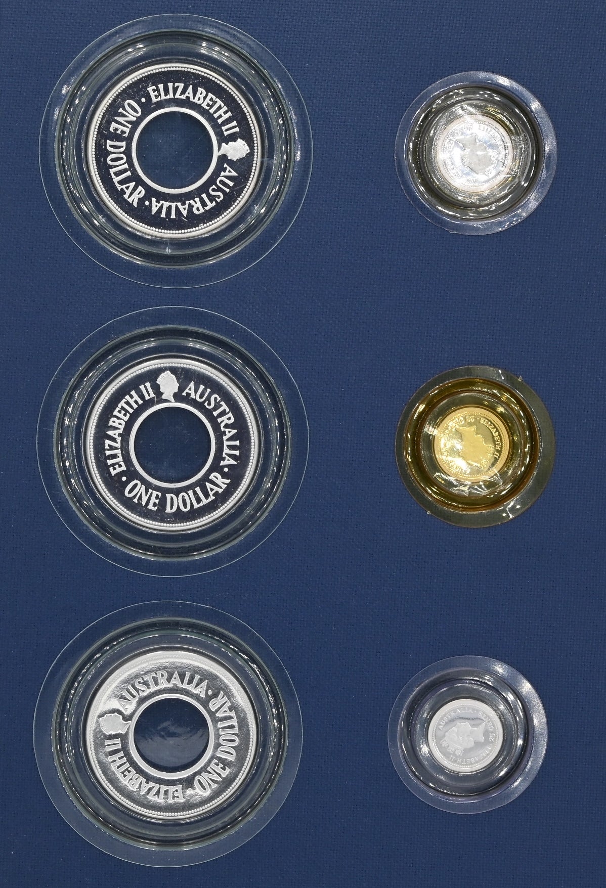 1988-1990 The Holley Dollar and Dump Six Coin Collection and Book.