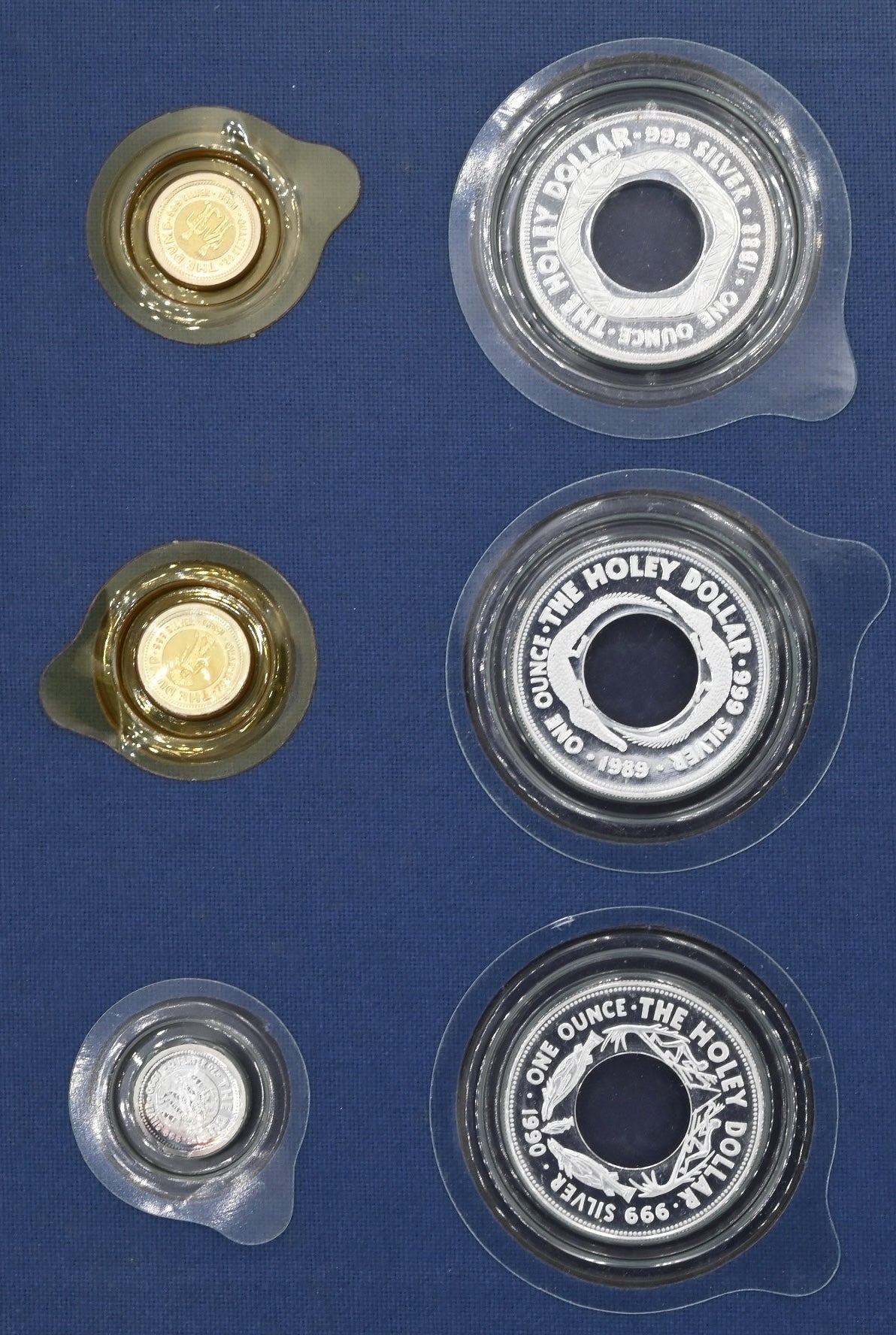 1988-1990 The Holley Dollar and Dump Six Coin Collection and Book.