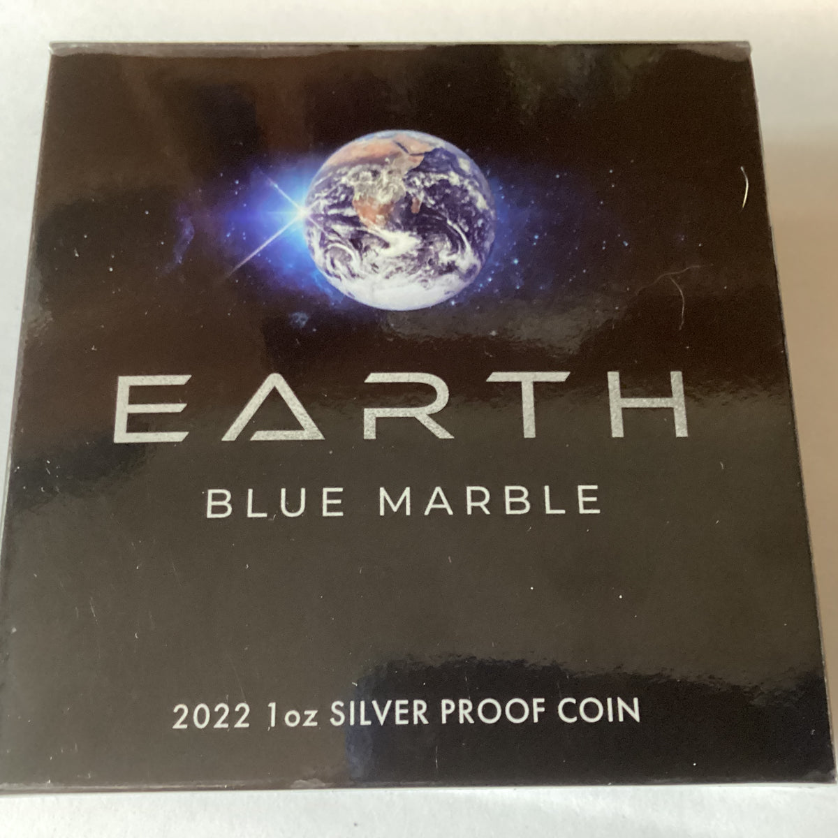 2022 $1 1oz Silver Coloured Proof Coin. Earth Blue Marble. – Ensleigh Coins