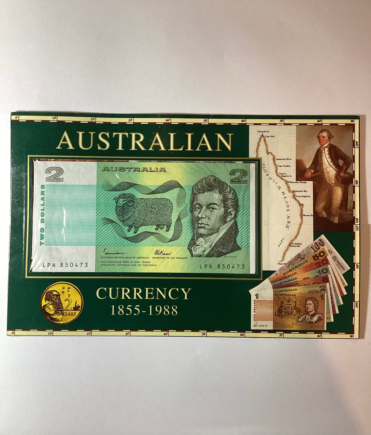 2000s $2 coin and banknote in folder